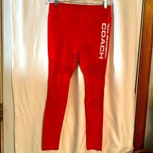Beachbody Team Coach orange Yoga pants.Size Med.